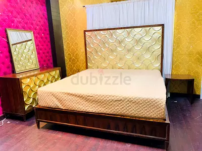 Elegant Wooden Bed with Matching Nightstand and Dresser