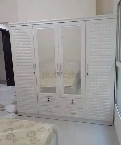 Elegant White Wardrobe with Mirror and Drawers