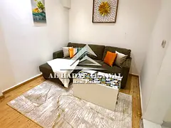 Studio apartment for rent, divided into a room and a living room.