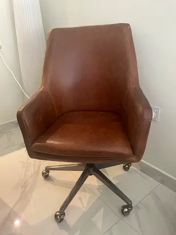 Original price 2500 AED. West elm Brown Swivel Chair