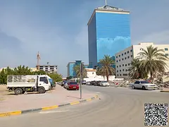 Land on a road and service lane in Liwara, Ajman, near the Free Zone.