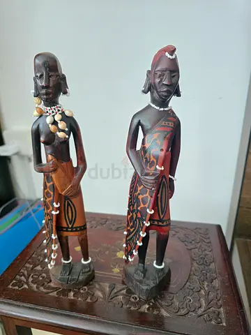Two wooden statues of African figurines