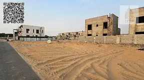 Two residential townhouse plots for sale in a prime location in Al Zahia 2.