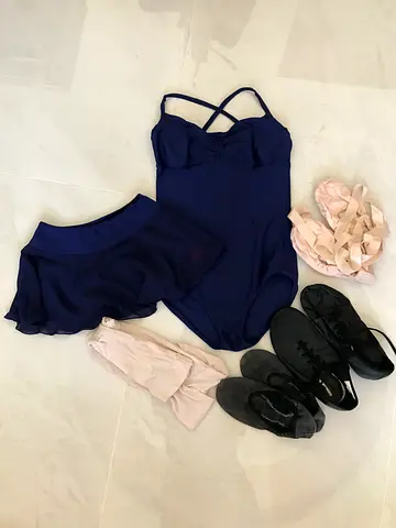 A training kit for ballet or dance classes. It includes the basic equipment needed for class. Kit Co