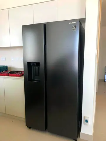 Samsung Side-By-Side Refrigerator in Sleek Black Finish water dispenser with ice maker