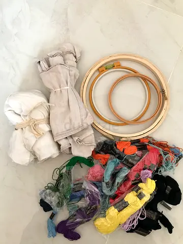 A basic embroidery kit that includes all the necessary tools and materials to get started with cross