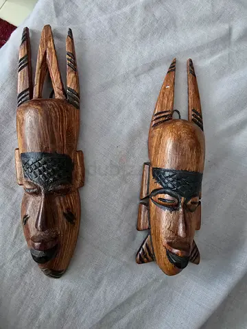 Two carved wooden mask from Africa.