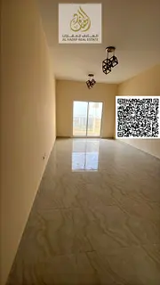 First Resident Building in Al Jurf 3: One-bedroom apartment with a living room, two bathrooms, and a