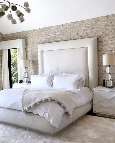 Elegant White Upholstered Bed with Stylish Nightstands