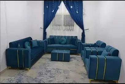 Elegant Blue Upholstered Sofa Set with Curtains and Rug