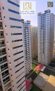 A spacious two-bedroom apartment is for sale in Ajman One Towers, offering a generous layout with a