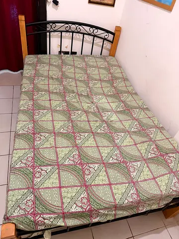 Beautiful Green and Pink Patterned Bed