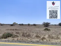 Corner plot for sale in Ajman - Al Manama 8, On the asphalt road.