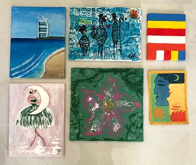 Small paintings in various artistic styles. Paintings: The set includes a landscape depicting the Bu