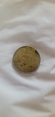 Antique Coin featuring Intricate Design