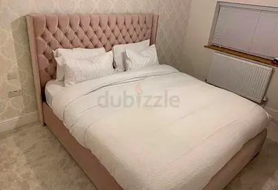 Elegant Queen Size Bed with Plush Upholstery