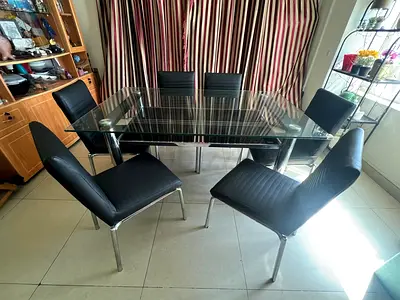 Modern Glass Dining Table with Black Chairs