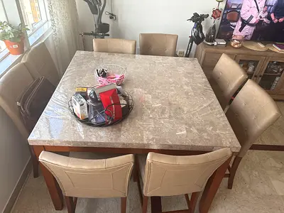 Stylish Dining Table with Leather Chairs