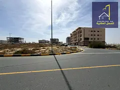 a mixed-use residential and commercial land plot located in Tilal area – Al Suyoh Suburb, Emirate 