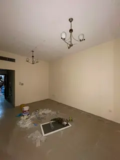 For rent in Muwaileh: spacious 1BR, 2 baths, balcony, prime location near schools &amp; malls, direc