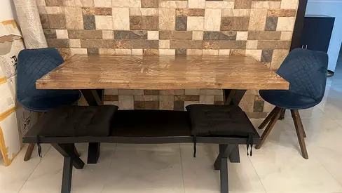 Classic wooden finish dining table from Pan.