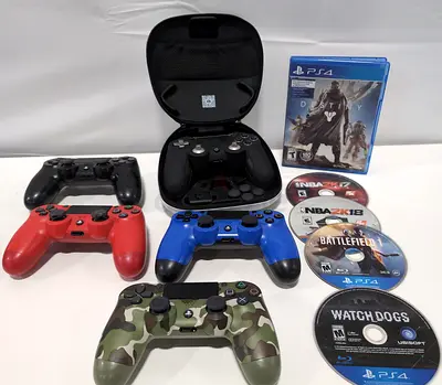 Variety of PlayStation 4 Controllers and Cds