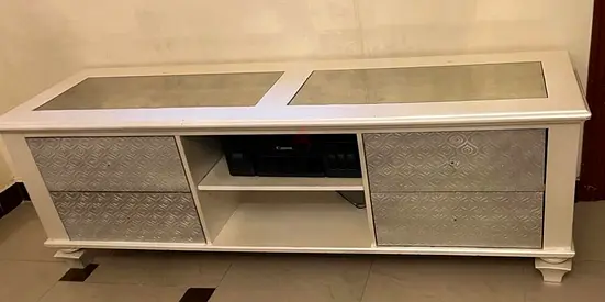 Elegant White Entertainment Center with Decorative Drawer Panels