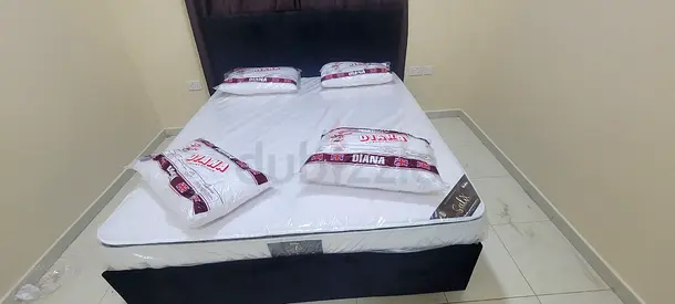 Comfortable Queen Size Bed with Mattress and Pillows