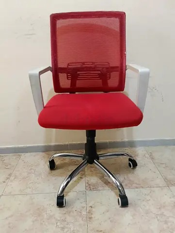 Office chair for sale in red with back support, reclining backrest, and adjustable armrests.  The me