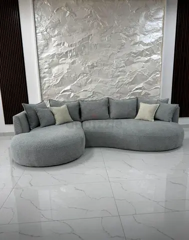 Stylish Curved Sofa with Plush Cushions