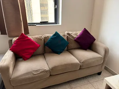 Sofa with Colorful Cushions and Glass table
