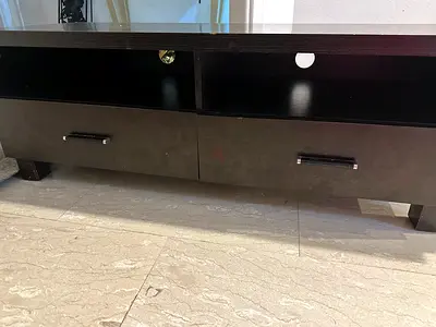A television table black color with 2 drawers