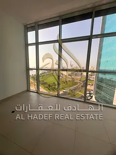 For rent in Al Majaz 1 - a luxurious apartment with 3 bedrooms and a hall , 2 parking spaces, and a