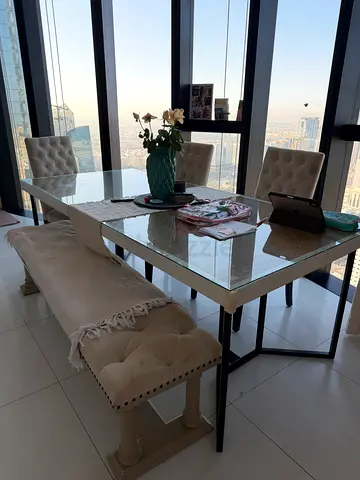 Elegant Glass Dining Table with Chic Chairs