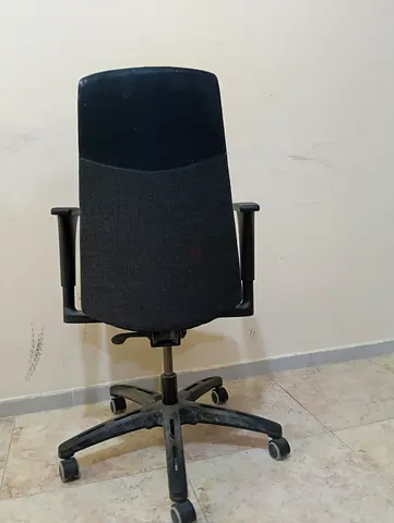 Office chair for sale in black with back support, reclining backrest, and adjustable armrests. The m