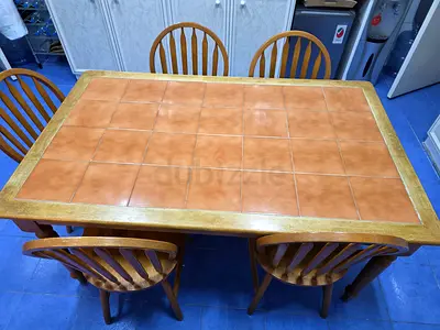 Spacious Dining Table with Wooden Chairs