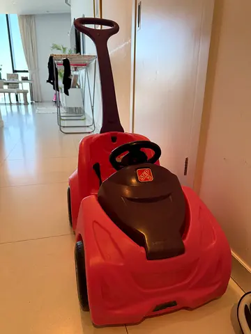 Bright Pink Kids Ride-On Toy