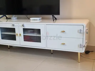 Stylish White TV Unit with Gold Accents