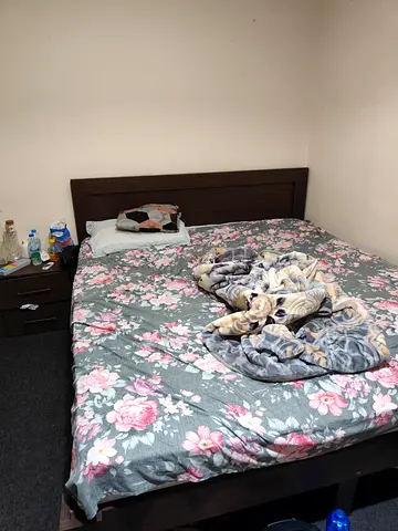 Comfortable Queen Size Bed with Floral Bedding