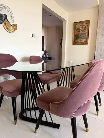 Elegant Glass Dining Table with Plush Chairs