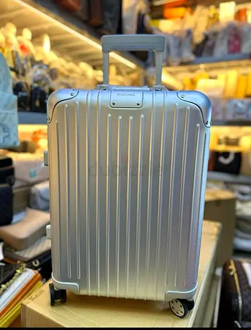 Rimowa silver hard shell luggage