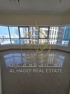 For rent in Al Khan: 3 rooms and a living room, open view, free parking, and free gym.