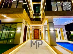 A luxurious corner villa with 7 bedrooms, a private pool, elevator, and rooftop terrace – price in