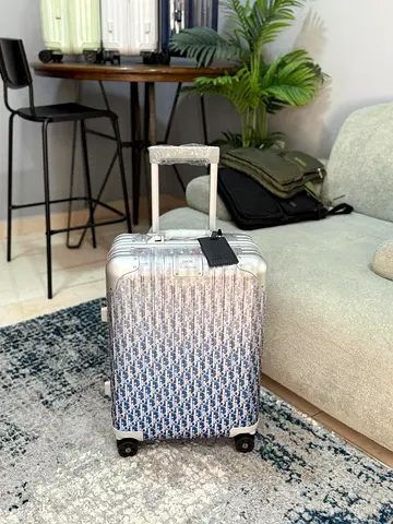 Stylish Dior hard case luggage travel in style