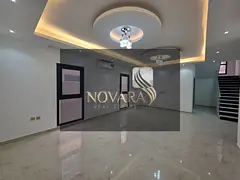 Elegant villa with 5 master bedrooms, 2 kitchens, and multiple parking spaces in Al Yasmin, priced a