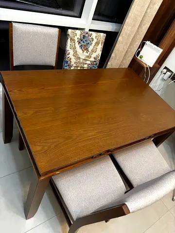 4 seater solid wood dining table with 4 chairs.