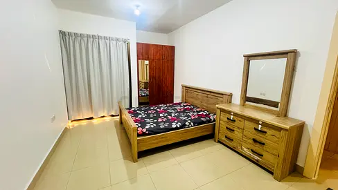Furnished Master Bedroom with Balcony