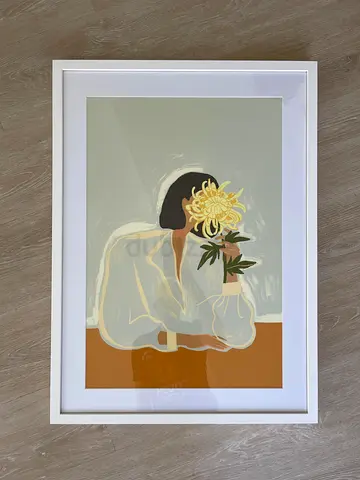 Framed Art Print Featuring a Woman with a Flower