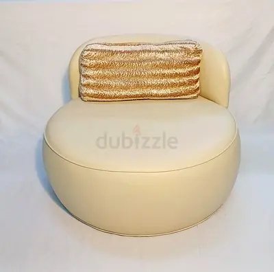 Stylish Round Cream Armchair with Decorative Cushion