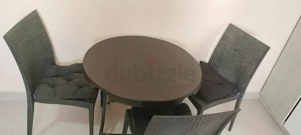 Stylish Black Outdoor Dining Set with Cushioned Chairs